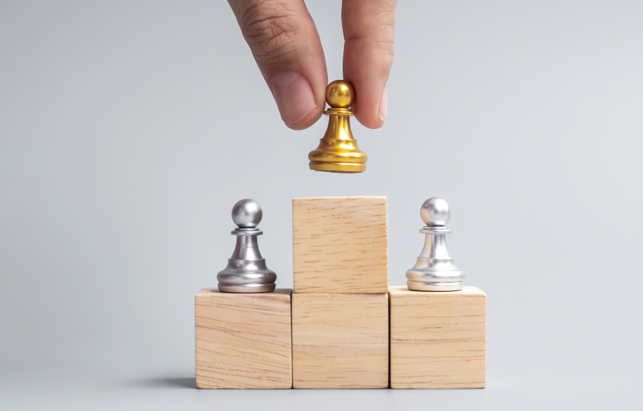 Image of blocks with golden chess piece on the top