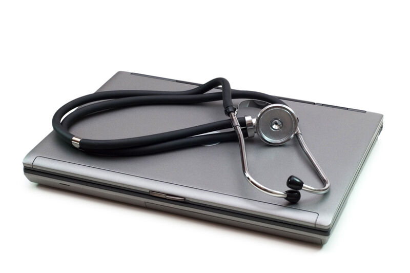 A picture of a stethoscope and laptop illustrating concept of digital security