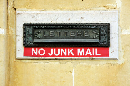 A letterbox with no junk mail written on it