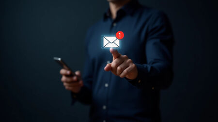 An image showing a finger on an envelope representing the clicking of an email