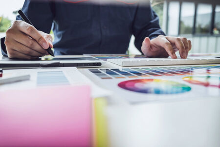 Image of male creative graphic designer working on email footer design